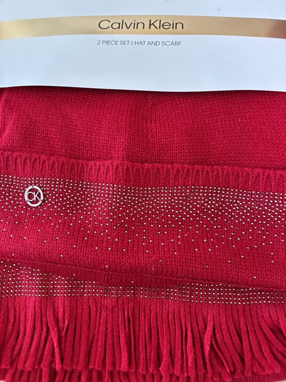 Calvin KleinNWT Scarf & Hat Set
Red Rouge with Silver CK
Logo & Sparkle - Picture 2 of 9